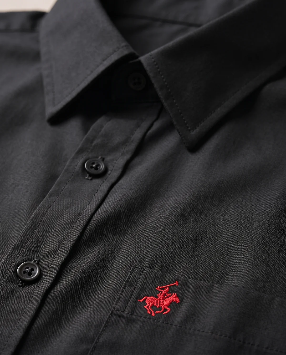 Short-Sleeve Button-Down in Black, fabric and stitching detail