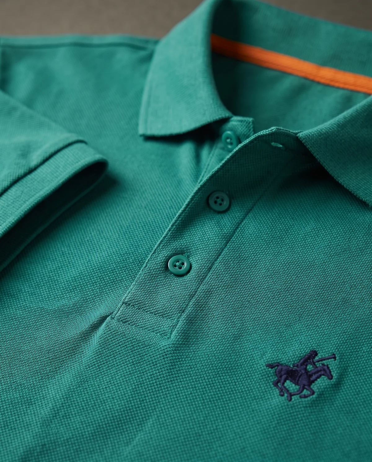 Piqué Polo in Teal, fabric and stitching detail